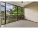 Screened-in porch with a view of the backyard and greenery at 309 Plank Bridge Way, Morrisville, NC 27560