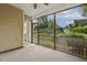Covered and screened porch, providing an outdoor living space with a view of the landscaped yard at 309 Plank Bridge Way, Morrisville, NC 27560
