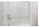 Spotless white bathtub features a chrome showerhead and colorful shower curtain for added privacy at 310 Bay Dr, Cary, NC 27511