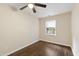 Bright bedroom features beautiful hardwood floors, a ceiling fan, and a sunlit window at 310 Bay Dr, Cary, NC 27511
