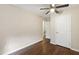 Spacious bedroom with hardwood floors, ceiling fan, closet, and access to other areas at 310 Bay Dr, Cary, NC 27511