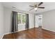Cozy bedroom featuring hardwood floors, a ceiling fan, and lots of natural light at 310 Bay Dr, Cary, NC 27511