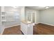 Dining Area with hardwood floor, window, and white island counter at 310 Bay Dr, Cary, NC 27511