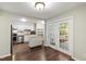 Bright eat-in kitchen featuring white cabinets, stainless steel appliances, and an island at 310 Bay Dr, Cary, NC 27511