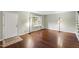Inviting living room with hardwood floors, bright windows, and neutral walls at 310 Bay Dr, Cary, NC 27511