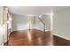 Open-concept living room featuring hardwood floors, staircase, and neutral walls at 310 Bay Dr, Cary, NC 27511