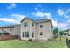 Back exterior of a two-story home featuring vinyl siding, many windows, and a fenced-in backyard at 3449 S Beaver Ln, Raleigh, NC 27604
