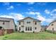 Back exterior of a two-story house with a fenced-in backyard and lush lawn at 3449 S Beaver Ln, Raleigh, NC 27604