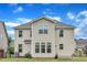 Back exterior of a two-story home with large windows and a well-manicured lawn at 3449 S Beaver Ln, Raleigh, NC 27604