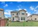 Well-maintained backyard with a privacy fence, a black fence, lush lawn, and mature trees at 3449 S Beaver Ln, Raleigh, NC 27604
