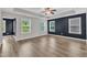 Bright bedroom showcasing multiple windows, tray ceiling, and a tranquil color scheme at 3449 S Beaver Ln, Raleigh, NC 27604