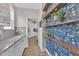 Butler's pantry showcases wood shelves, patterned wallpaper, granite counters, and herringbone backsplash at 3449 S Beaver Ln, Raleigh, NC 27604