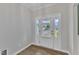 Bright foyer featuring wood-look flooring and sidelights, creating an inviting entrance at 3449 S Beaver Ln, Raleigh, NC 27604