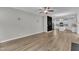 Open floor plan with hardwood floors leading to kitchen, dining, and living spaces at 3449 S Beaver Ln, Raleigh, NC 27604