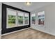 Bright sunroom with a wall of windows and hardwood floors at 3449 S Beaver Ln, Raleigh, NC 27604