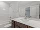 Well-lit bathroom featuring a vanity with a white countertop, dark cabinets, and a shower-tub combo at 347 N. Maple Walk Dr # 211, Garner, NC 27529