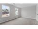 Bright bedroom features two windows and neutral carpet, offering a serene and comfortable living space at 347 N. Maple Walk Dr # 211, Garner, NC 27529