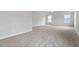 Vast main bedroom offering large windows, neutral carpet and ceiling fan at 347 N. Maple Walk Dr # 211, Garner, NC 27529