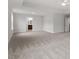 Large main bedroom featuring carpet and a ceiling fan with ensuite bathroom access at 347 N. Maple Walk Dr # 211, Garner, NC 27529