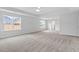 Spacious main bedroom featuring carpet, ceiling fan and large windows at 347 N. Maple Walk Dr # 211, Garner, NC 27529