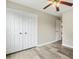 Bedroom featuring wood-look flooring and double closets at 366 E Smithfield St, Angier, NC 27501