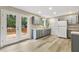 Modern kitchen with stainless steel appliances, ample cabinets, and access to the back deck at 366 E Smithfield St, Angier, NC 27501