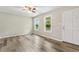 Bright living room with wood-look flooring and views of the front yard through the windows at 366 E Smithfield St, Angier, NC 27501
