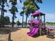 Playground with slides, climbing structures, and a mulch ground cover in a recreational area by the lake at 366 E Smithfield St, Angier, NC 27501