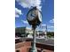 Image of the city clock, surrounded by historic brick buildings, street lights, and vibrant landscaping at 366 E Smithfield St, Angier, NC 27501