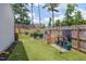 A well-maintained backyard featuring raised garden beds, lush lawn, and mature trees providing shade and privacy at 40 Bourne Dr, Franklinton, NC 27525