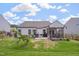 Backyard with outdoor grill and kitchen, patio, screen porch, and well-kept lawn in a fenced yard at 40 Bourne Dr, Franklinton, NC 27525
