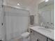 Bright bathroom with a shower-tub combo and a gray vanity with a quartz countertop and a large mirror at 40 Bourne Dr, Franklinton, NC 27525