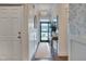 Elegant foyer with stylish wallpaper, wood flooring, and an elegant chandelier creating a welcoming ambiance at 40 Bourne Dr, Franklinton, NC 27525