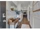 Inviting entryway featuring elegant wainscoting, stylish wallpaper, wood floors, and a view into the living area at 40 Bourne Dr, Franklinton, NC 27525