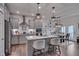 Open kitchen with an island and seating, stainless appliances, and seamless flow to the dining area at 40 Bourne Dr, Franklinton, NC 27525