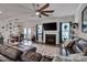 Inviting living room featuring a fireplace, modern ceiling fan, hardwood floors, and stylish décor at 40 Bourne Dr, Franklinton, NC 27525