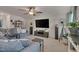 Cozy living room with a sectional sofa, large TV, and ceiling fan at 40 Bourne Dr, Franklinton, NC 27525