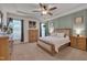 Spacious main bedroom featuring a ceiling fan, carpeted floor, and a neutral color palette for a relaxing atmosphere at 40 Bourne Dr, Franklinton, NC 27525
