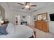 Bright main bedroom showcasing a plush bed, dresser, and connecting doors to other rooms at 40 Bourne Dr, Franklinton, NC 27525