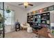 Charming home office boasts a comfortable chair, built-in shelving, and a cozy reading nook at 40 Bourne Dr, Franklinton, NC 27525