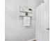 Bright bathroom with decorative shelving, towel, and shower at 4004 Bamburgh Ln, Apex, NC 27539