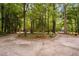 Circular driveway providing access to a home in wooded setting at 4004 Bamburgh Ln, Apex, NC 27539