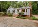 Charming home featuring brick accents, bay window, and lush landscaping at 4004 Bamburgh Ln, Apex, NC 27539
