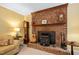 Living room brick fireplace with vintage stove and wooden mantle at 4004 Bamburgh Ln, Apex, NC 27539