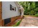 Inviting front entrance featuring a brick step way leading to a charming covered porch and blue siding at 4004 Bamburgh Ln, Apex, NC 27539