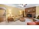 Relaxing living room showcasing brick fireplace and comfortable seating arrangement at 4004 Bamburgh Ln, Apex, NC 27539