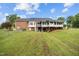 Spacious backyard with covered deck, great for relaxing or entertaining at 4024 Rural Retreat Rd, Burlington, NC 27215