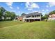 Large backyard with covered deck perfect for relaxing and entertainment at 4024 Rural Retreat Rd, Burlington, NC 27215
