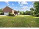 The lush, green backyard offers space for outdoor enjoyment and recreation at 4024 Rural Retreat Rd, Burlington, NC 27215