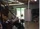 Unfinished basement with drop ceiling, access to outside, and additional storage space at 4024 Rural Retreat Rd, Burlington, NC 27215